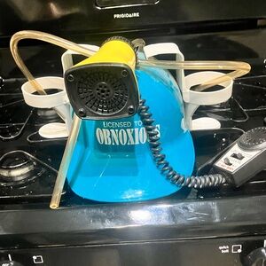 “Licensed To Be OBNOXIOUS” Safety Helmet With 2 Can Holders & Megaphone Speaker